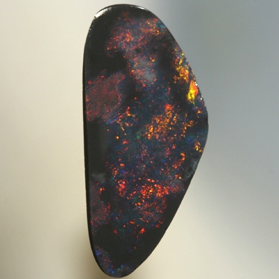 SOLID BLACK OPAL Red fire moves between black opal